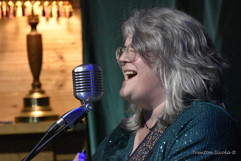 Close up of Patty singing at Waller's Coffee shop with Gin Joint Rascals